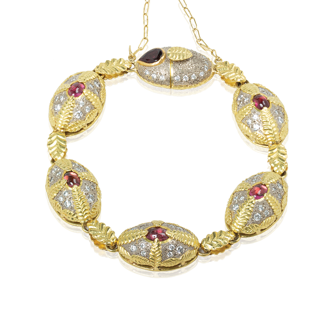 high jewelry Gold bracelet with gemstones on a white background