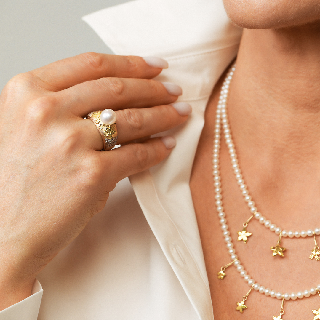 Beautiful gold diamonds and pearls ring on an model