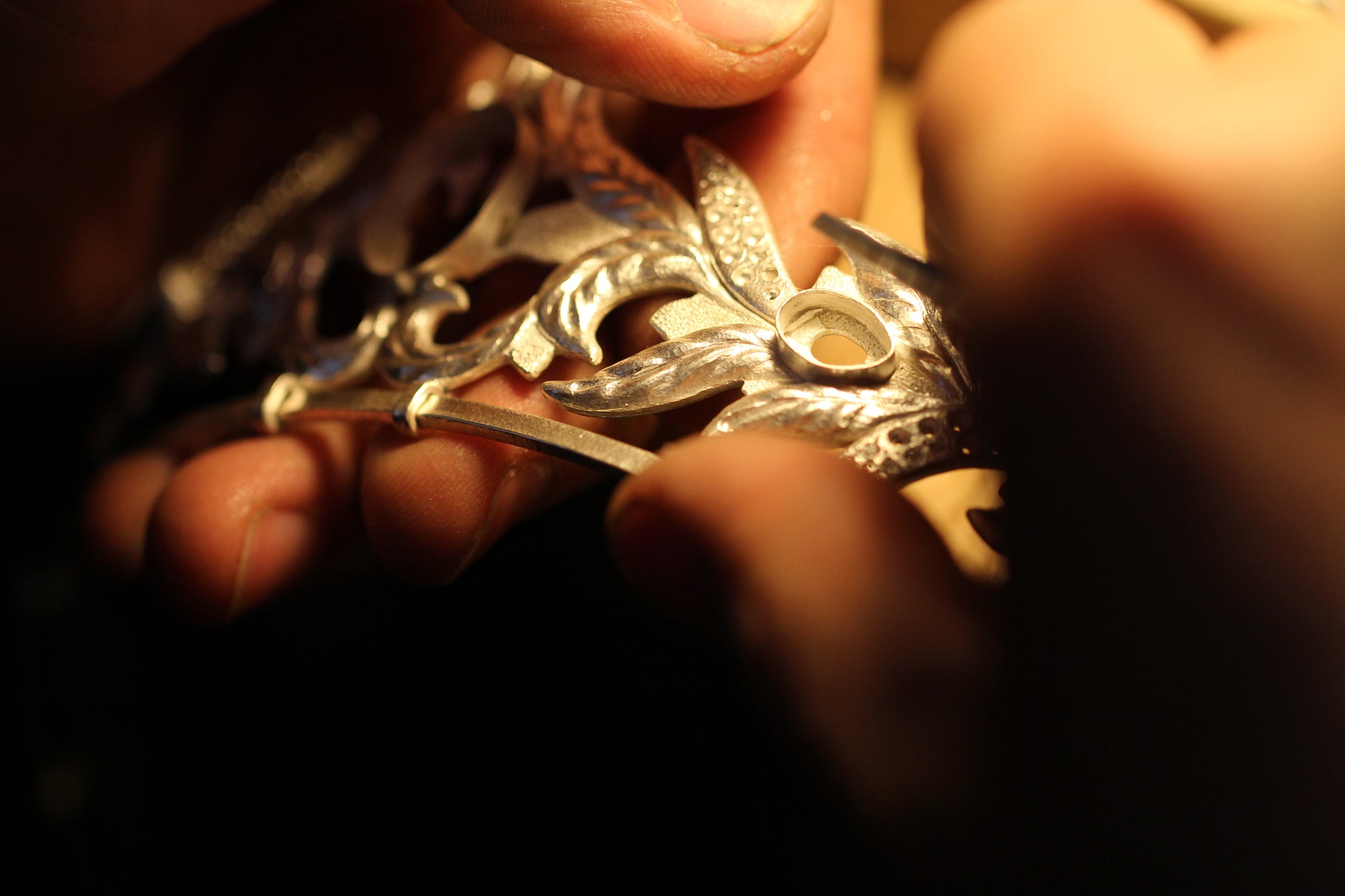 Close up of artisans working on gold tiara in Marilisi atelier a picture behind the scenes