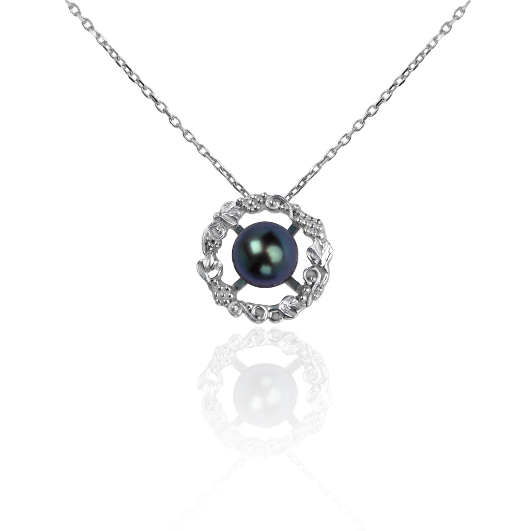 Marilisi artisan fine jewelry Black Pearl White Gold ring pearls are set in gold frames full