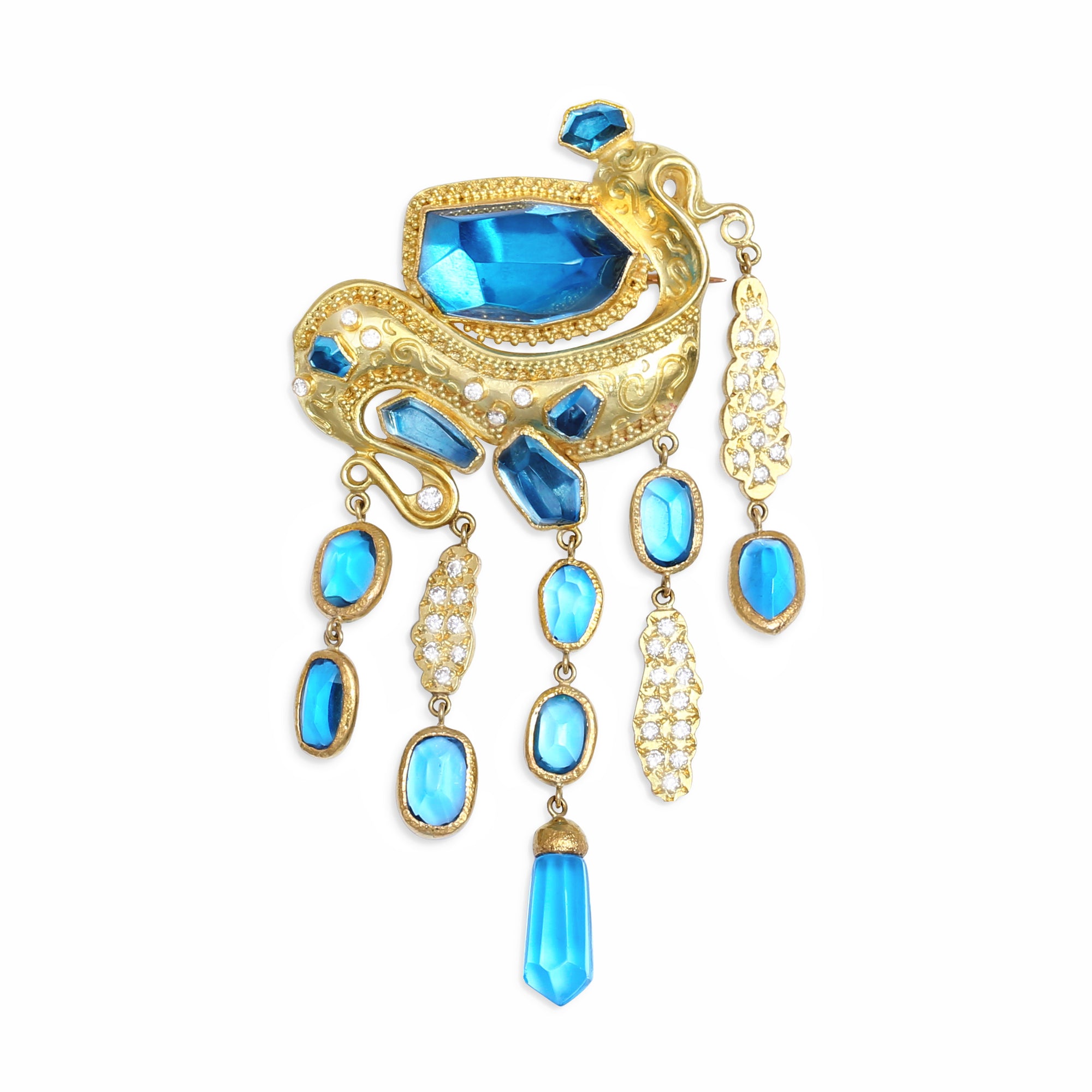 High jewelry gold brooch adorned with blue topaz and diamonds