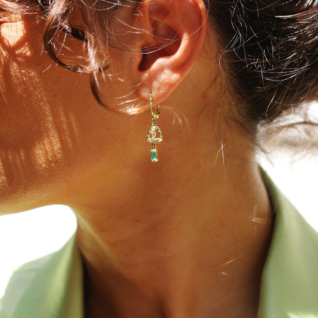 Beautiful Model in Green Suit is wearing emerald Earrings Chviruli by Marilisi