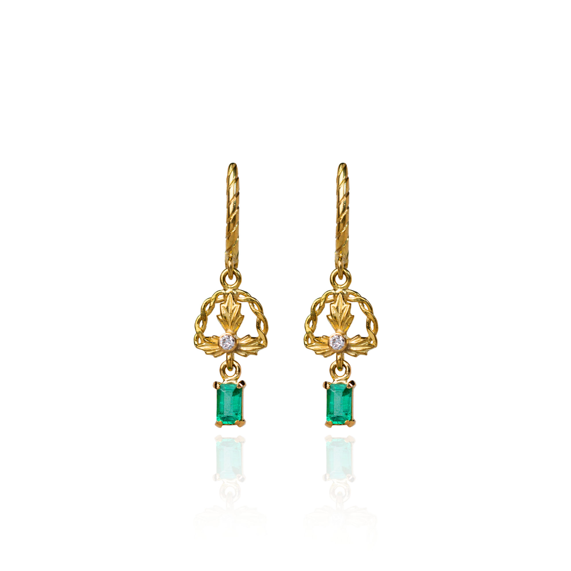 Gold and emerald earrings crafted by Marilisi's artisans feature intricate grapevine motif, celebrating Georgia and its antique goldsmithing techniques