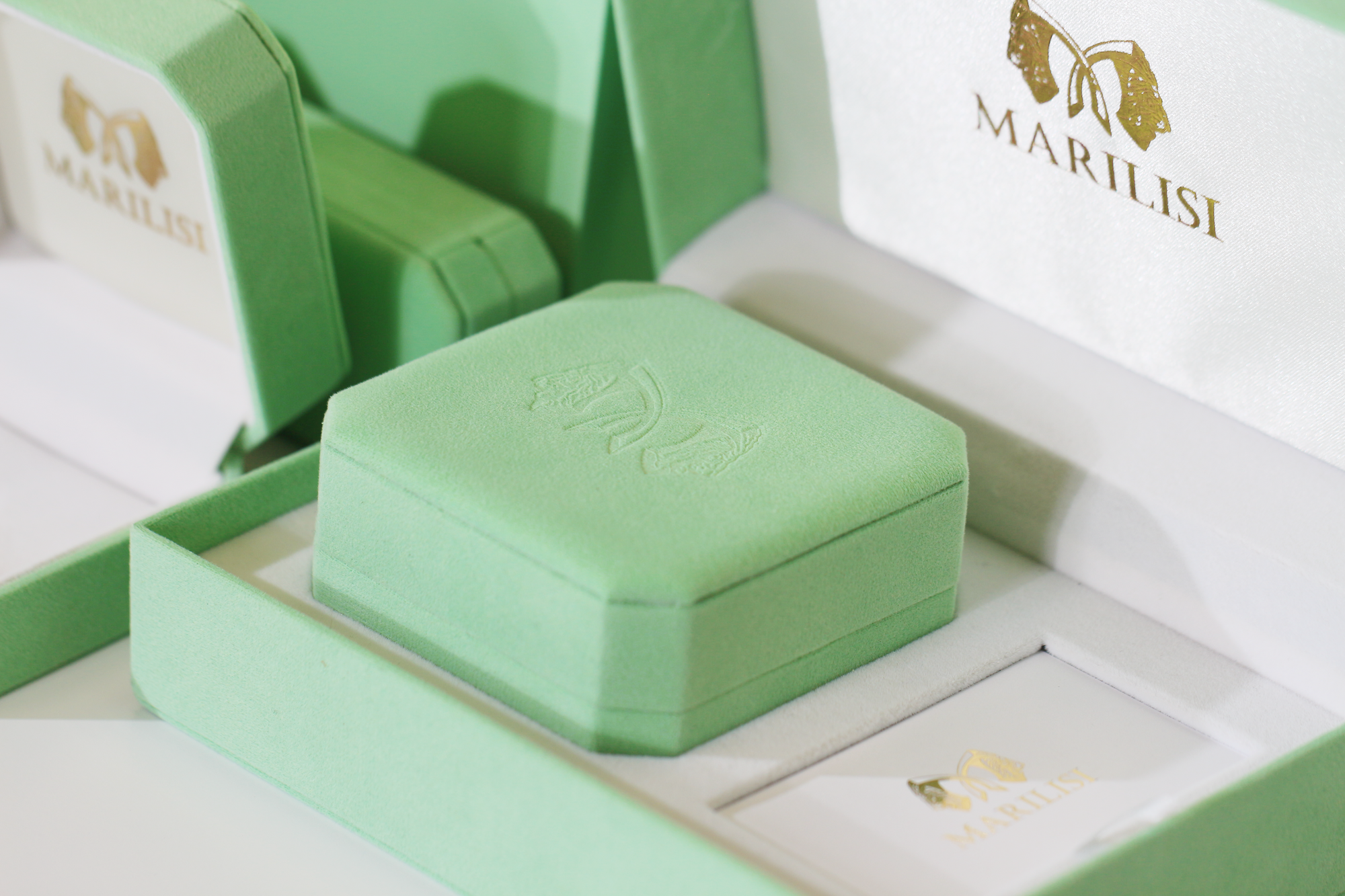 Signature green packaging and gift boxes from Marilisi Jewelry House