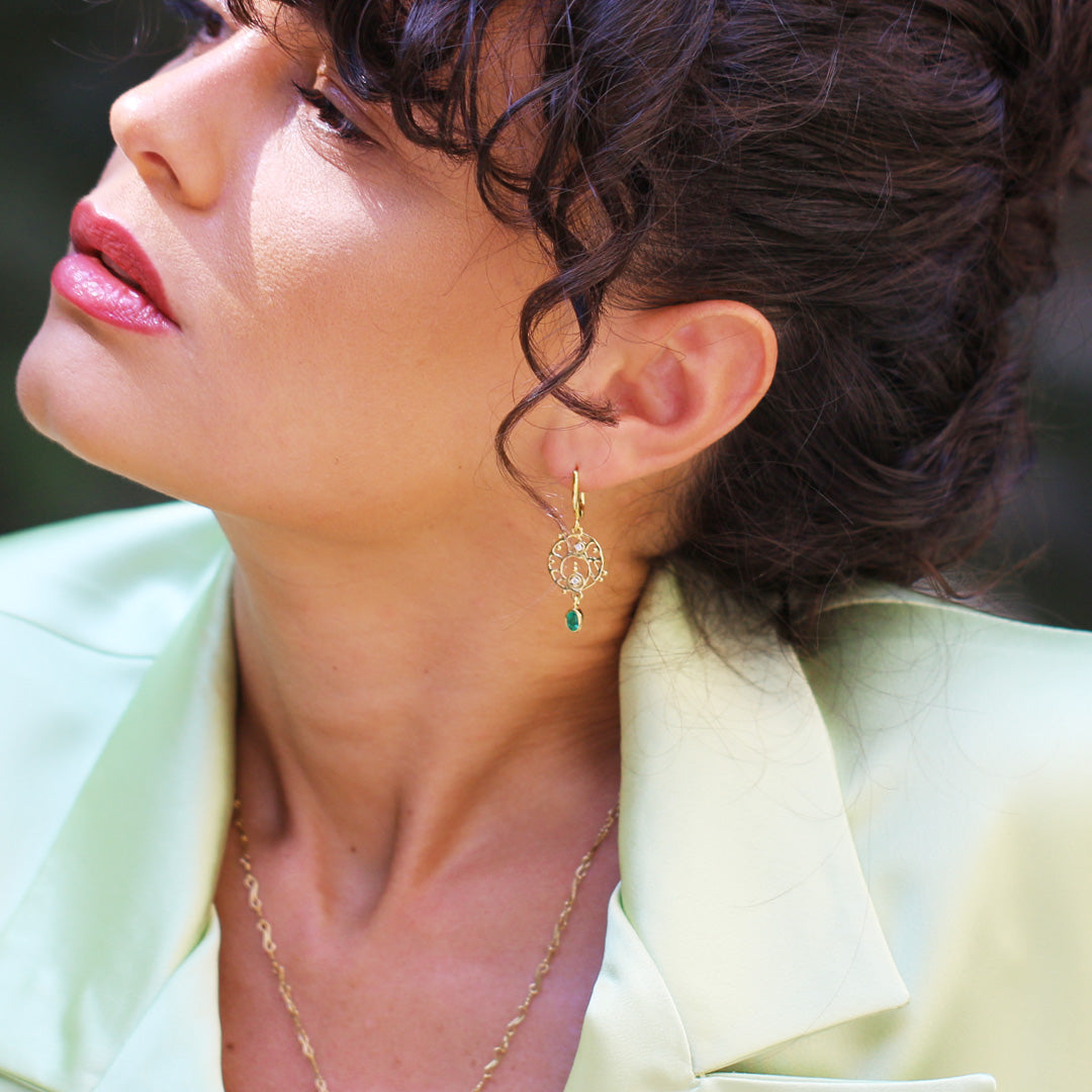 Beautiful Brunette Model wearing Marilisi Emerald Earrings Assymetry