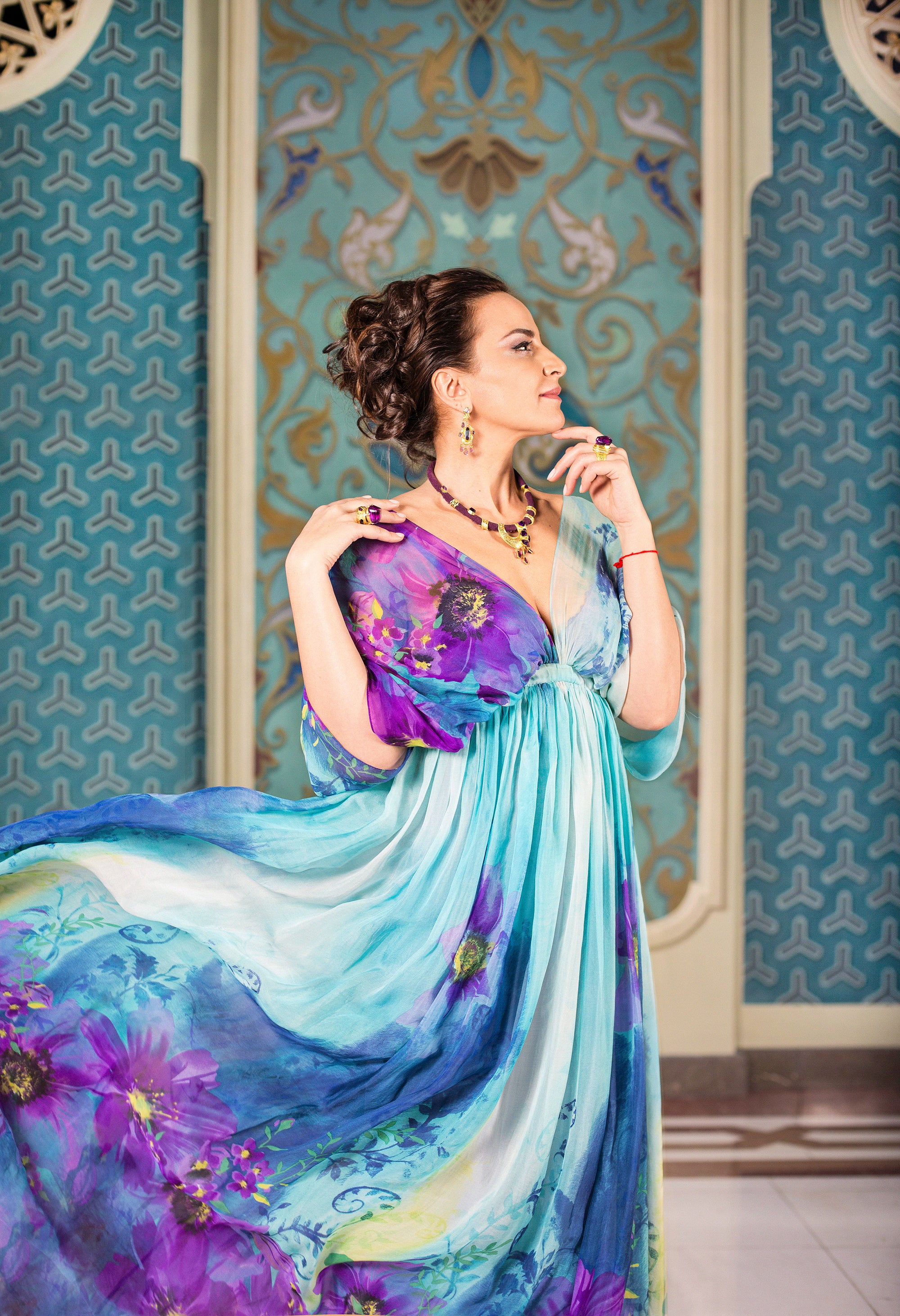 Beautiful Georgian Actress wearing couture dress and jewelry with amethysts