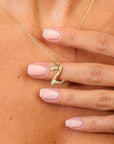 Gold necklace with a 'Z' pendant worn by a person