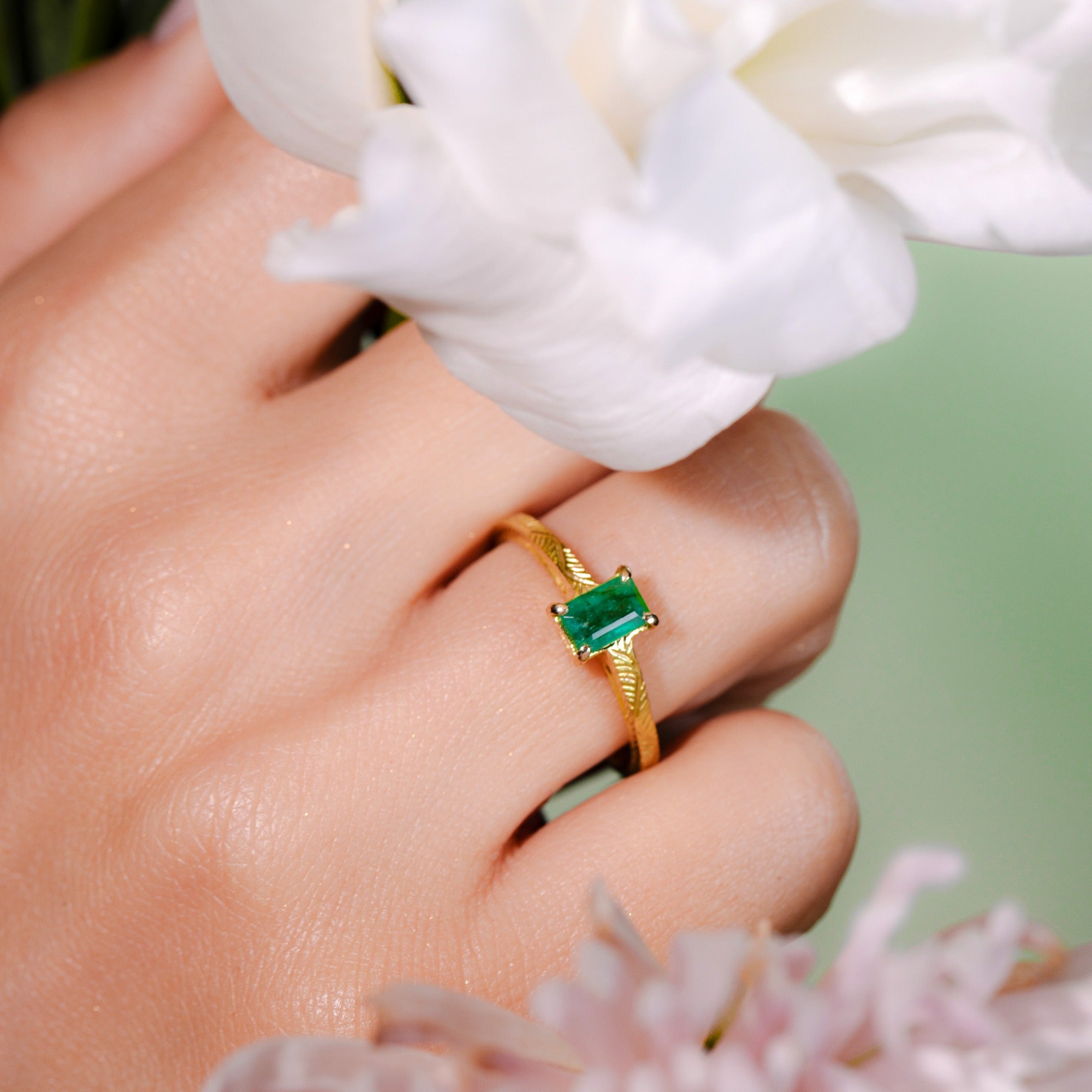 close up of the model wearing emerald ring solo by Marilisi Jewelry House handcrafted jewelry
