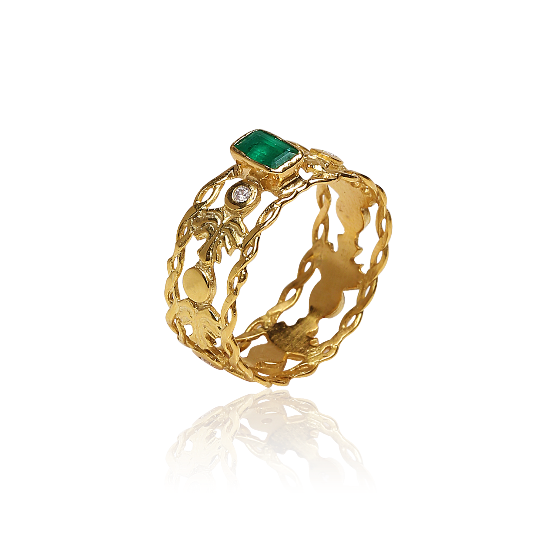 Artisan gold ring with vivid green emerald and diamond, featuring intricate grapevine leaf design by Marilisi Jewelry House