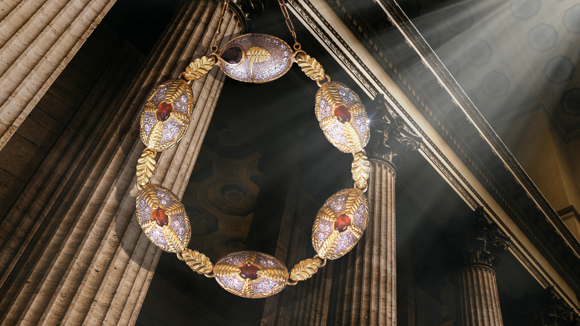 Ornate necklace with gemstones hanging against a classical architecture background